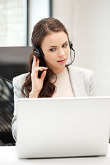 Image showing helpline operator with laptop computer