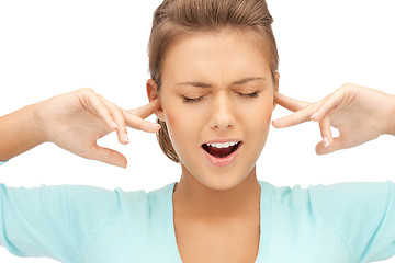 Image showing woman with fingers in ears