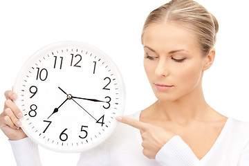 Image showing woman holding big clock