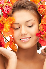 Image showing lovely woman with red flowers