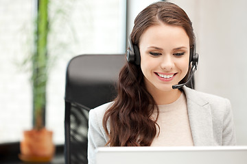 Image showing helpline operator with laptop computer