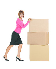 Image showing attractive businesswoman with big boxes