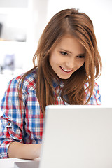 Image showing happy woman with laptop computer