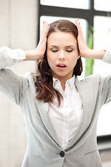 Image showing woman with hands on ears