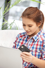 Image showing happy woman with laptop computer and credit card