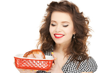 Image showing lovely housewife with meat