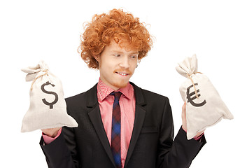 Image showing man with euro and dollar bags