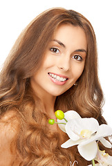 Image showing beautiful woman with orchid flower