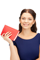 Image showing happy and smiling woman with book