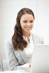 Image showing happy woman with laptop computer