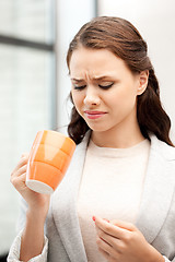 Image showing lovely businesswoman with mug