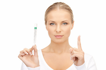 Image showing attractive female doctor with thermometer