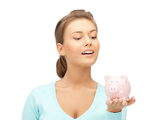 Image showing lovely woman with piggy bank