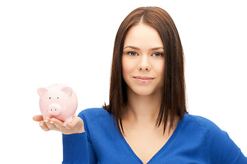 Image showing lovely woman with piggy bank