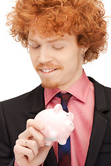 Image showing man with piggy bank