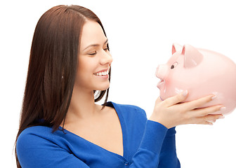 Image showing lovely woman with piggy bank