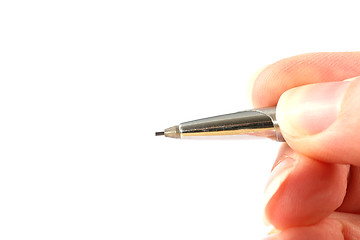 Image showing Hand holding a pencil