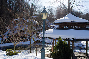 Image showing wooden bower roof snow retro lighting river winter 