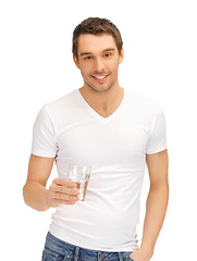 Image showing man in white shirt with glass of water