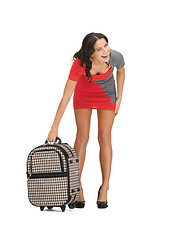 Image showing unhappy woman with heavy suitcase