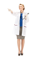 Image showing attractive female doctor pointing her finger