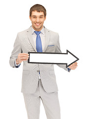 Image showing businessman with direction arrow sign