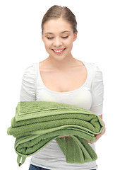 Image showing lovely housewife with towels