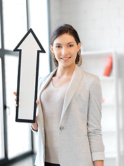 Image showing businesswoman with direction arrow sign