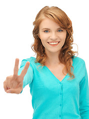 Image showing teenage girl showing victory sign