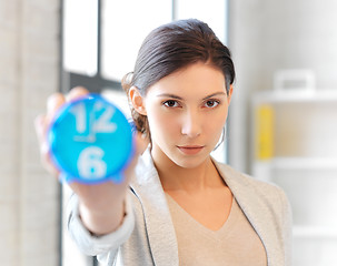 Image showing businesswoman with clock