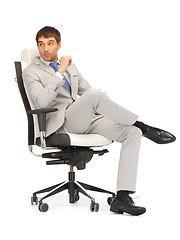 Image showing young businessman sitting in chair