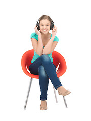 Image showing happy teenage girl in big headphones