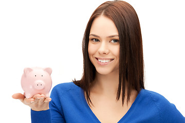 Image showing lovely woman with piggy bank