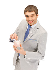 Image showing man with piggy bank