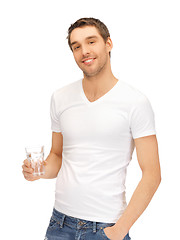 Image showing man in white shirt with glass of water