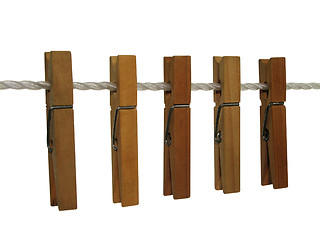 Image showing Wooden clothespins on a clothes line (+ clipping path)