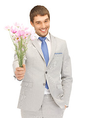 Image showing handsome man with flowers in hand