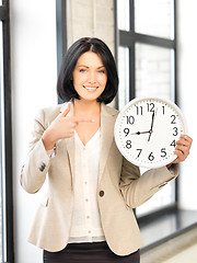 Image showing businesswoman with clock