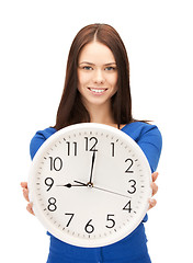 Image showing woman holding big clock