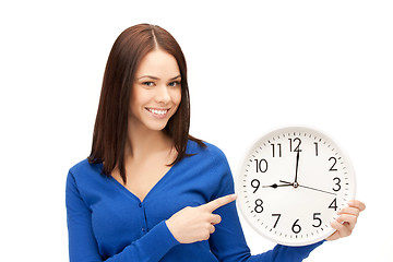 Image showing woman holding big clock