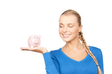 Image showing lovely woman with piggy bank