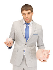 Image showing man with piggy bank