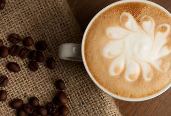 Image showing cup of coffee and beans