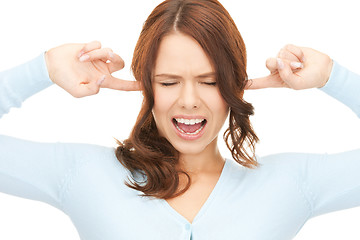 Image showing woman with fingers in ears