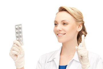 Image showing attractive female doctor with pills