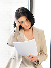 Image showing calm woman with documents
