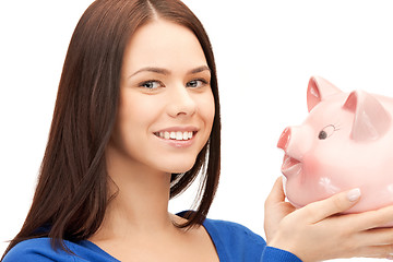 Image showing lovely woman with piggy bank