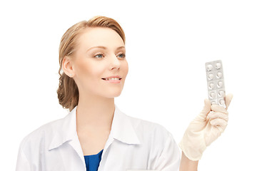 Image showing attractive female doctor with pills