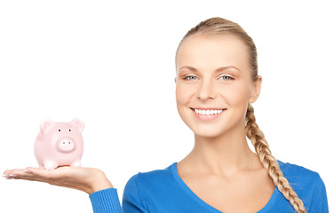 Image showing lovely woman with piggy bank