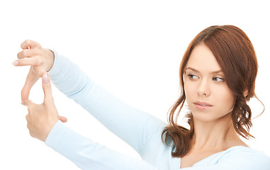 Image showing lovely woman creating a frame with fingers